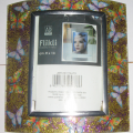 Cornice-elittica-con-farfalle
